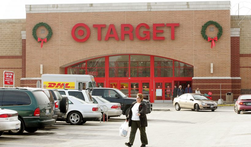 ROSEMONT, IL - DECEMBER 2: A shopper walks through the parking lot of a Target store December 2, 2004 in Rosemont, Illinois. Several major national retailers have banned Salvation Army bell ringers including Target stores. (Photo by Tim Boyle/Getty Images)