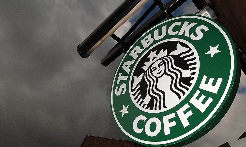 NORTHWICH, UNITED KINGDOM - JULY 03: The Starbucks logo hangs outside one of the company's cafes in Northwich on 3 July, 2008 in Northwich, England. Starbucks Corp in the US recently announced that it plans to close 600 company-operated stores in the country which represent about 7 percent of Starbucks' global workforce. Many UK consumers are beginning to cut back on luxuries as the global credit crunch begins to bite. (Photo by Christopher Furlong/Getty Images)