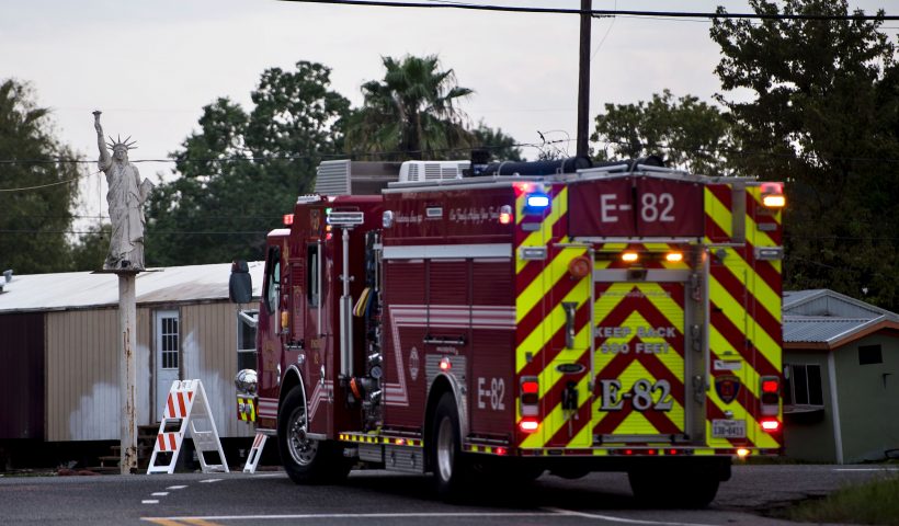 A firetruck waits at a roadblock after a chemical plant operated by the Arkema Group had an explosion during the aftermath of Hurricane Harvey on August 31, 2017 in Crosby, Texas. Local emergency officials reported two explosions Thursday at a flooded chemical plant in the Texas town of Crosby, its operators Arkema Inc said. "At approximately 2:00 am CDT (0700 GMT), we were notified by the Harris County Emergency Operations Center (EOC) of two explosions and black smoke coming from the Arkema Inc plant in Crosby, Texas," the company statement said. / AFP PHOTO / Brendan Smialowski (Photo credit should read BRENDAN SMIALOWSKI/AFP via Getty Images)