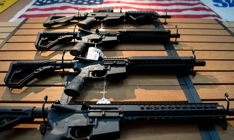 Assault rifles hang on the wall for sale at Blue Ridge Arsenal in Chantilly, Virginia, on October 6, 2017. (Photo by JIM WATSON / AFP) (Photo by JIM WATSON/AFP via Getty Images)