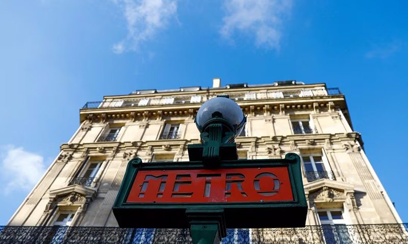 A metro sign is seen in a street in Paris. REUTERS/Gonzalo Fuentes/File Photo