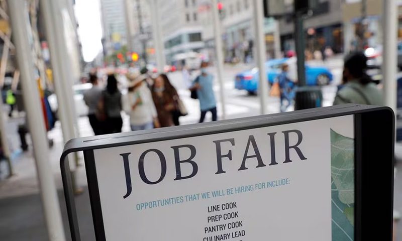 Signage for a job fair is seen on 5th Avenue after the release of the jobs report in Manhattan, New York City, U.S., September 3, 2021. REUTERS/Andrew Kelly/File Photo