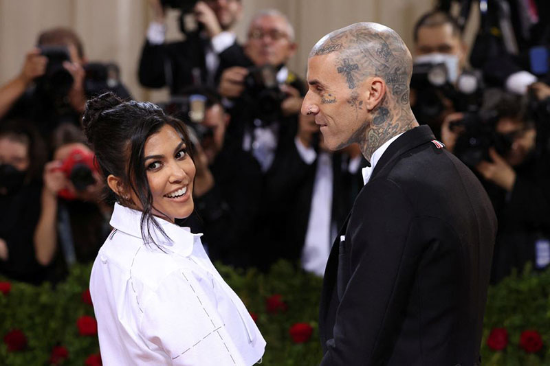 Travis Barker and Kourtney Kardashian arrive at the In America: An Anthology of Fashion themed Met Gala at the Metropolitan Museum of Art in New York City, New York, U.S., May 2, 2022. REUTERS/Andrew Kelly/File Photo