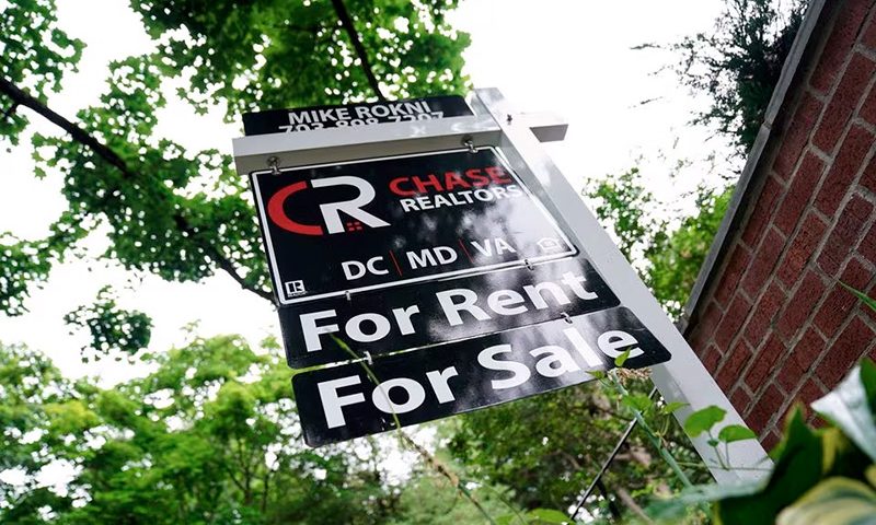A "For Rent, For Sale" sign is seen outside of a home in Washington, U.S., July 7, 2022. REUTERS/Sarah Silbiger/File Photo