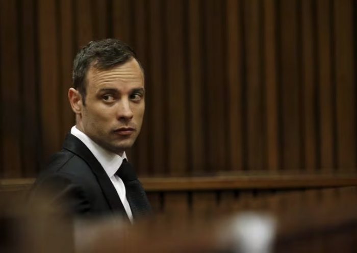 Oscar Pistorius sits in the dock at the North Gauteng High Court in Pretoria, South Africa for a bail hearing, December 8, 2015. REUTERS/Siphiwe Sibeko/File Photo