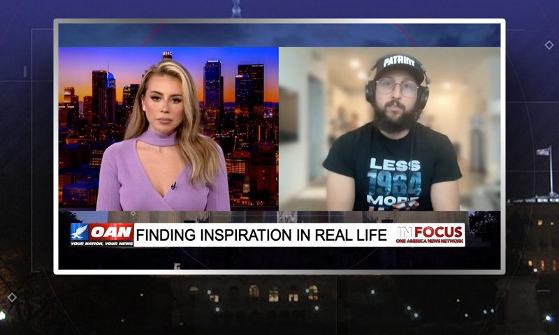 Video still from In Focus on One America News Network showing a split screen of the host on the left side, and on the right side is the guest, Hi-Rez The Rapper.