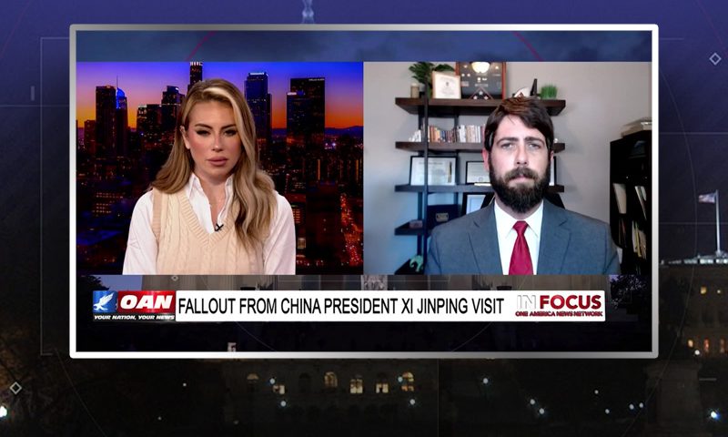 Video still from In Focus on One America News Network showing a split screen of the host on the left side, and on the right side is the guest, Alex Newman.