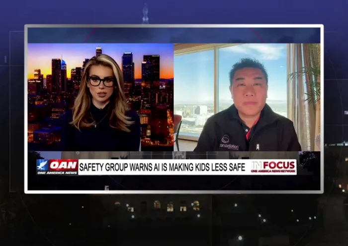 Video still from In Focus on One America News Network showing a split screen of the host on the left side, and on the right side is the guest, Ray Wang.
