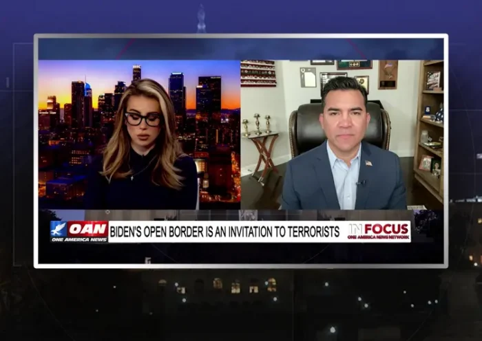 Video still from In Focus on One America News Network showing a split screen of the host on the left side, and on the right side is the guest, Victor Avila.