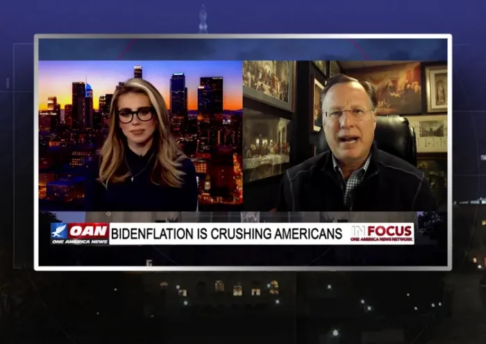 Video still from In Focus on One America News Network showing a split screen of the host on the left side, and on the right side is the guest, Dave Brat.