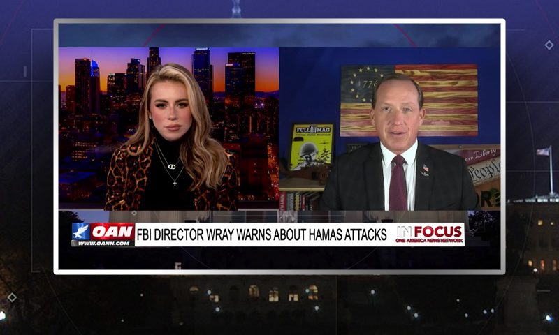 Video still from In Focus on One America News Network showing a split screen of the host on the left side, and on the right side is the guest, Lt. Col. Darin Gaub (Ret.).