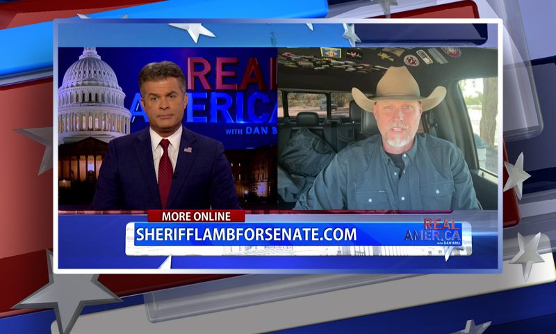 Video still from Real America on One America News Network showing a split screen of the host on the left side, and on the right side is the guest, Mark Lamb.