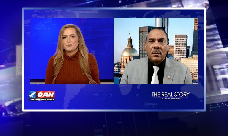 Video still from The Real Story on One America News Network showing a split screen of the host on the left side, and on the right side is the guest, Bruce LeVell.