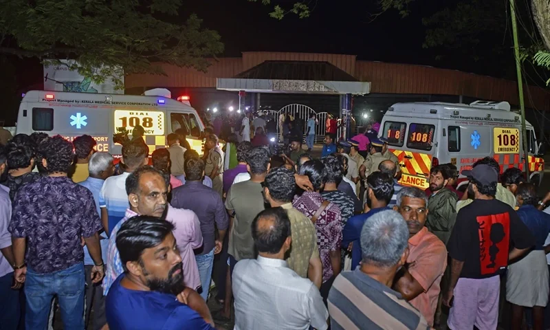 of 2 | People gather outside after a stampede at the venue of a music concert at the Cochin University of Science and Technology in Kochi, Kerala state, India, Saturday, Nov.25, 2023. Four people died and dozens of students were injured in the incident. (AP Photo)