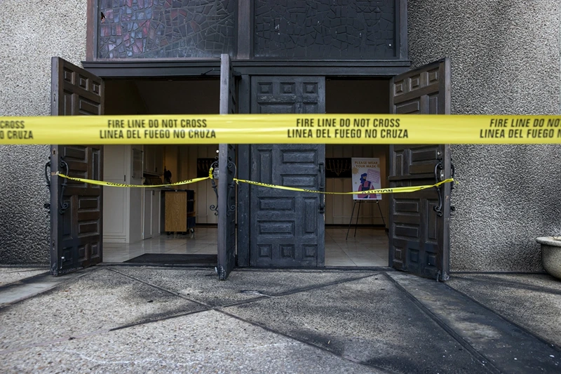 1 of 5 | Caution tape marks the front doors at Congregation Beth Israel on Nov. 1, 2021, after someone started a fire at the Central Austin synagogue in Austin, Texas, the previous day. Franklin Sechriest who set fire to the synagogue in an antisemitic attack two years ago was sentenced on Wednesday, Nov. 29, 2023, to 10 years in prison. (Jay Janner/Austin American-Statesman via AP)
