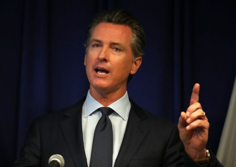 SACRAMENTO, CALIFORNIA - SEPTEMBER 18: California Gov. Gavin Newsom speaks during a news conference at the California justice department on September 18, 2019 in Sacramento, California. California Gov. Gavin Newsom, California attorney general Xavier Becerra and California Air Resources Board Chair Mary Nichols held a news conference in response to the Trump Administration's plan to revoke California’s waiver to establish vehicle emissions standards for greenhouse gas emissions and standards to require manufacturers to sell zero emissions vehicles. Under the federal Clean Air Act, California is allowed to set its own vehicle emissions standards that are at least as protective as the federal government’s standards. The state has received 100 waivers from the Environmental Protection Agency (EPA) for higher standards than federally mandated over the past 50 years. (Photo by Justin Sullivan/Getty Images)