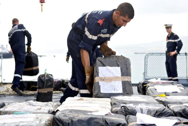 French navy personel onboard the French fregate Le Ventose handle, on March 25, 2011 in the Fort-de-France harbour in the French overseas island Martinique, the three tons of cocaine they sized few days before on a boat in international waters off Costa Rica. The Ventose patrols the zone as part of a Caribbean anti-drugs agreement signed by France, the United States, the Netherlands, Belize, Costa Rica, Guatemala, and the Dominican Republic. AFP PHOTO PATRICE COPPEE (Photo by PATRICE COPPEE / AFP) (Photo by PATRICE COPPEE/AFP via Getty Images)