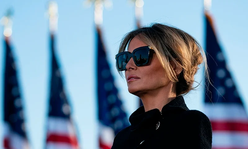 Outgoing First Lady Melania Trump listens as her husband Outgoing US President Donald Trump addresses guests at Joint Base Andrews in Maryland on January 20, 2021. - President Trump and the First Lady travel to their Mar-a-Lago golf club residence in Palm Beach, Florida, and will not attend the inauguration for President-elect Joe Biden. (Photo by ALEX EDELMAN / AFP) (Photo by ALEX EDELMAN/AFP via Getty Images)