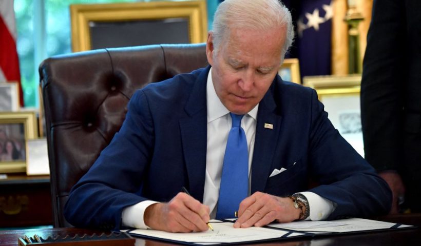 US President Joe Biden signs into law the Ukraine Democracy Defense Lend-Lease Act of 2022, in the Oval Office of the White House in Washington, DC, on May 9, 2022. - President Joe Biden on Monday eased the acceleration of US weapons shipments to Ukraine through a law based on a World War II measure helping US allies to defeat Nazi Germany. (Photo by Nicholas Kamm / AFP) (Photo by NICHOLAS KAMM/AFP via Getty Images)