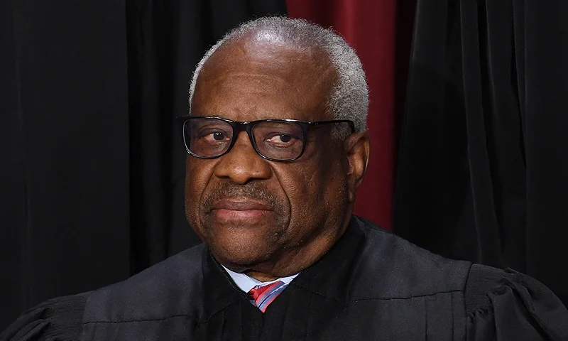 Associate US Supreme Court Justice Clarence Thomas poses for the official photo at the Supreme Court in Washington, DC on October 7, 2022. (Photo by OLIVIER DOULIERY / AFP) (Photo by OLIVIER DOULIERY/AFP via Getty Images)