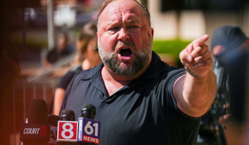 WATERBURY, CONNECTICUT - SEPTEMBER 21: InfoWars founder Alex Jones speaks to the media outside Waterbury Superior Court during his trial on September 21, 2022 in Waterbury, Connecticut. Jones is being sued by several victims' families for causing emotional and psychological harm after they lost their children in the Sandy Hook massacre. A Texas jury last month ordered Jones to pay $49.3 million to the parents of 6-year-old Jesse Lewis, one of 26 students and teachers killed in the shooting in Newtown, Connecticut. (Photo by Joe Buglewicz/Getty Images)