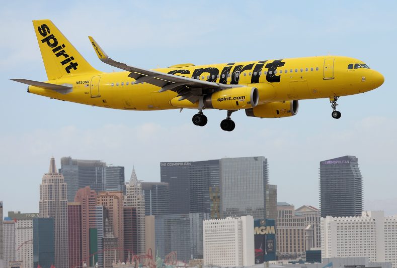 LAS VEGAS, NEVADA - OCTOBER 15: A Spirit Airlines plane lands at Harry Reid International Airport on October 15, 2022 in Las Vegas, Nevada. Holiday airfare prices are expected to be the most expensive in the last 5 years with Thanksgiving ticket prices up 25 percent from last year with the average round trip ticket price of $281. Christmas travel costs are up 55 percent from last year with round trip ticket prices averaging $435. (Photo by Justin Sullivan/Getty Images)