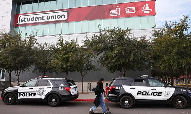 LAS VEGAS, NEVADA - DECEMBER 07: Police cars are parked in front of the student union the morning after a shooting left three dead at the University of Nevada, Las Vegas campus on December 07, 2023 in Las Vegas, Nevada. According to police, a suspect shot four people on the campus, killing three of them, before being killed by campus police. (Photo by Mario Tama/Getty Images)