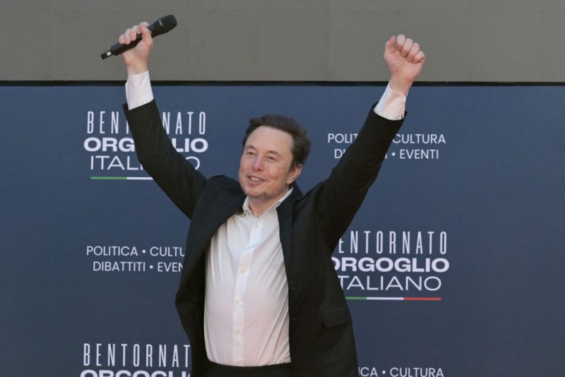 X (formerly Twitter) CEO Elon Musk raises his arms during the Atreju political meeting organised by the young militants of Italian right wing party Brothers of Italy (Fratelli d'Italia) on December 16, 2023 at the Sant'Angelo Castle in Rome. (Photo by Andreas SOLARO / AFP) (Photo by ANDREAS SOLARO/AFP via Getty Images)