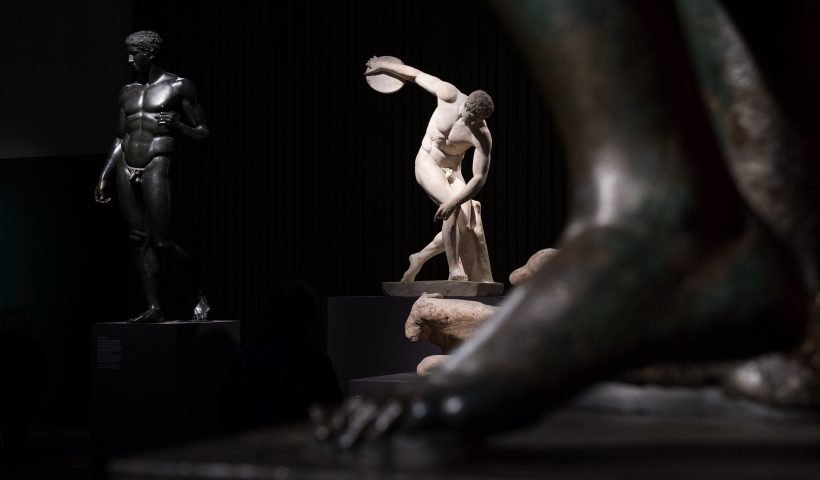 A bronze reconstruction of a lost Greek work (L) and a Roman copy of Myron's Discobolus (C) are displayed during a press preview of the British Museum's "Defining beauty: the body in ancient Greek art" in central London on March 24, 2015. Running from march 26 to July 5 2015, the exhibition explores the Greek preoccupation with the human form, and features around 150 objects. These include bronzes and vases as well as iconic white marble statues and sculptures. AFP PHOTO / LEON NEAL (Photo credit should read LEON NEAL/AFP via Getty Images)