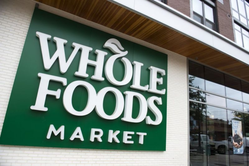 A Whole Foods Market sign is seen in Washington, DC, June 16, 2017, following the announcement that Amazon would purchase the supermarket chain for $13.7 billion. - Amazon is once again shaking up the retail sector, with the announcement it will acquire upscale US grocer Whole Foods Market, known for its pricey organic options, in a deal that underscores the online giant's growing influence in the economy. (Photo by SAUL LOEB / AFP) (Photo by SAUL LOEB/AFP via Getty Images)