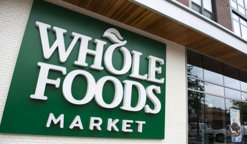 A Whole Foods Market sign is seen in Washington, DC, June 16, 2017, following the announcement that Amazon would purchase the supermarket chain for $13.7 billion. - Amazon is once again shaking up the retail sector, with the announcement it will acquire upscale US grocer Whole Foods Market, known for its pricey organic options, in a deal that underscores the online giant's growing influence in the economy. (Photo by SAUL LOEB / AFP) (Photo by SAUL LOEB/AFP via Getty Images)
