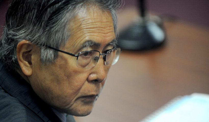 Peru's ex-president Alberto Fujimori is seen in a courtroom in Lima on September 30, 2009, before hearing the sentence on his fourth trial, in this case, for corruption charges including bribing Congress members, telephone espionage and illegal buying of tv channels and other media. Fujimori, president of Peru from 1990 to 2000, was sentenced last April to 25 years in prison for authorizing a secret army hit squad. AFP PHOTO/RAUL GARCIA PEREIRA (Photo credit should read RAUL GARCIA PEREIRA/AFP via Getty Images)