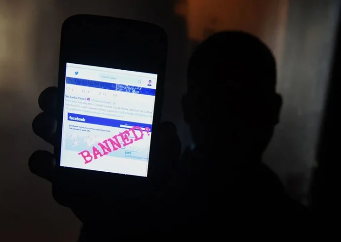 A Sri Lankan man mobile phone user shows an image on Twitter showing that the Facebook site had been blocked in Colombo on March 7, 2018. Telecommunication service providers said they have blocked access to facebook and several other social media platforms on the directive of the government which accused extremists of using the popular social media to spread hate speech and instigate violence against the Muslim minority in the country. (Photo by ISHARA S. KODIKARA / AFP) (Photo by ISHARA S. KODIKARA/AFP via Getty Images)