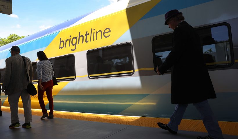 FORT LAUDERDALE, FL - MAY 11: Passengers load up on the Brightline train at the Fort Lauderdale station during the inaugural trip from Miami to West Palm Beach on May 11, 2018 in Fort Lauderdale, Florida. Brightline welcomed the media, politicians and other dignitaries to ride on the inaugural trip for the privately funded passenger train which is running from Miami to West Palm Beach with one stop in Fort Lauderdale. The $3.1 billion project, will eventually extend its rail system to Orlando International Airport and is scheduled to be completed by January 2021. (Photo by Joe Raedle/Getty Images)