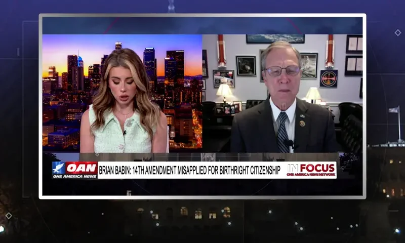 Video still from In Focus on One America News Network showing a split screen of the host on the left side, and on the right side is the guest, Rep. Brian Babin.