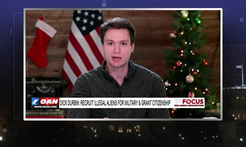 Video still from In Focus on One America News Network showing a split screen of the host on the left side, and on the right side is the guest, Luke Ball.