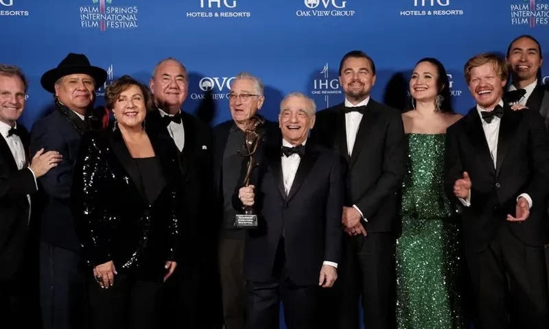 Martin Scorsese and the cast of "Killers of the Flower Moon," pose with the Vanguard Award at the 35th Annual Palm Springs International Film Festival Film Awards in Palm Springs, California, U.S., January 4, 2024. REUTERS/Mario Anzuoni