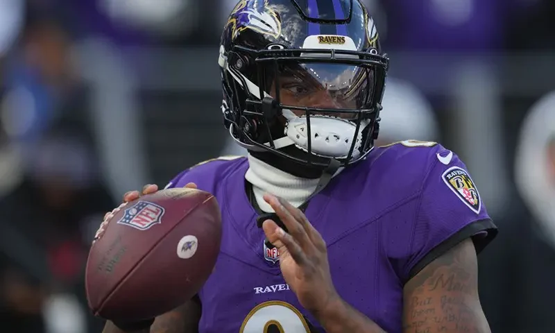 Baltimore Ravens quarterback Lamar Jackson (8) warms up before a 2024 AFC divisional round game against the Houston Texans at M&T Bank Stadium. Mandatory Credit: Mitch Stringer-USA TODAY Sports