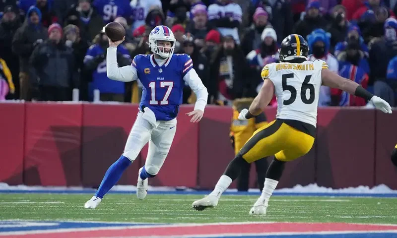 Buffalo Bills quarterback Josh Allen (17) pressured by Pittsburgh Steelers linebacker Alex Highsmith (56) in the first quarter in a 2024 AFC wild card game at Highmark Stadium. Mandatory Credit: Kirby Lee-USA TODAY Sports