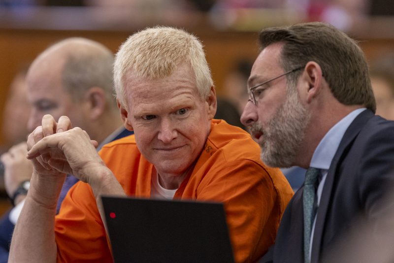 Alex Murdaugh, left, confers with Phil Barber during a judicial hearing at the Richland County Judicial Center in Columbia, S.C., Monday, Jan. 29, 2024. (Tracy Glantz/The State via AP, Pool)