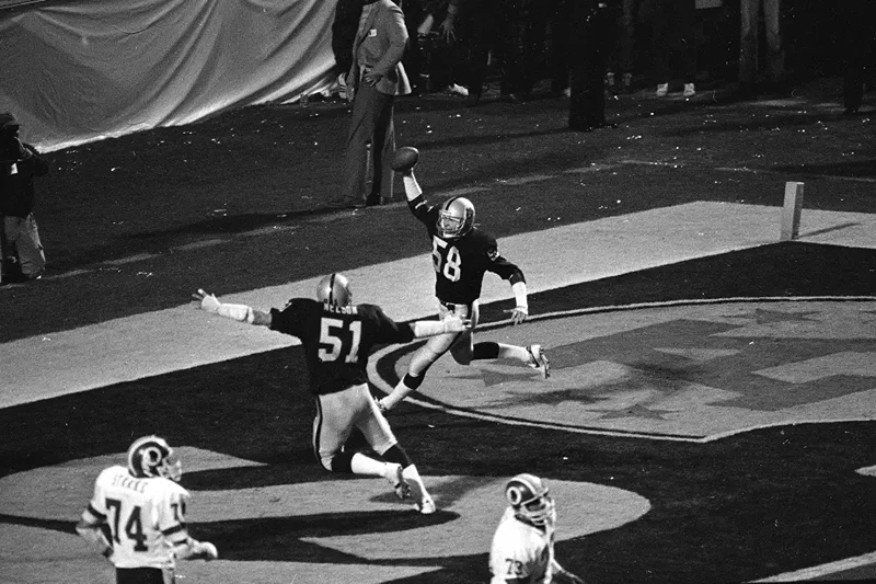 Squirek (58) celebrates after returning his interception for a touchdown in Super Bowl XIII against the Washington Redskins on Jan. 23, 1984.
(Photo via; AP/FILE)