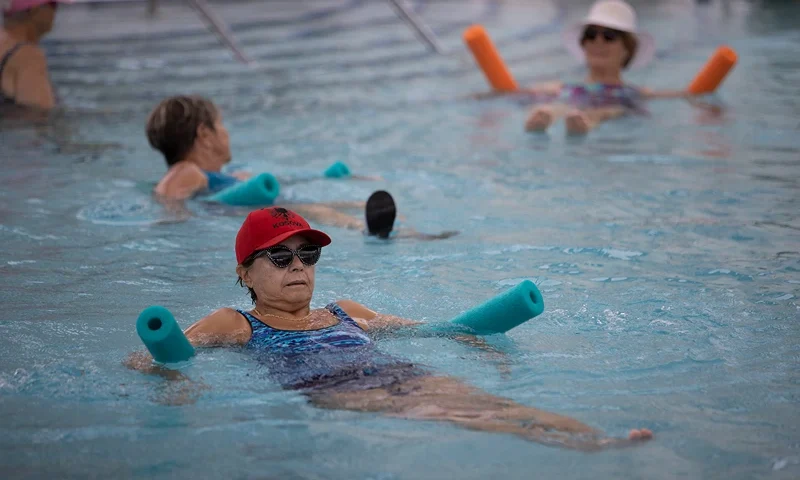 POMPANO BEACH, FLORIDA - OCTOBER 15: Maria Blagg participates in a water aerobics class in the pool at the John Knox Village Continuing Care Retirement Community, where she resides on October 15, 2021 in Pompano Beach, Florida. The Social Security Administration announced benefits will increase 5.9% in 2022. The cost-of-living adjustment is the largest since 1982, with the benefits compensating recipients for the current high inflation rate. (Photo by Joe Raedle/Getty Images)