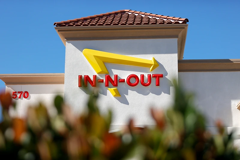 In-N-Out Burger Clashes With Local Governments Over Vaccine Verification Mandates
PLEASANT HILL, CALIFORNIA - OCTOBER 28: The In-n-Out logo is displayed on the front of an In-n-Out restaurant on October 28, 2021 in Pleasant Hill, California. Contra Costa county health officials shut down an In-n-Out restaurant in Pleasant Hill on Tuesday after the popular burger chain ignored repeated warnings to check the vaccination cards of customers who wanted to dine indoors. San Francisco health officials shut down the Fisherman's Wharf location for several days earlier in the month for the same issue. That location is currently only offering to go orders. (Photo by Justin Sullivan/Getty Images)