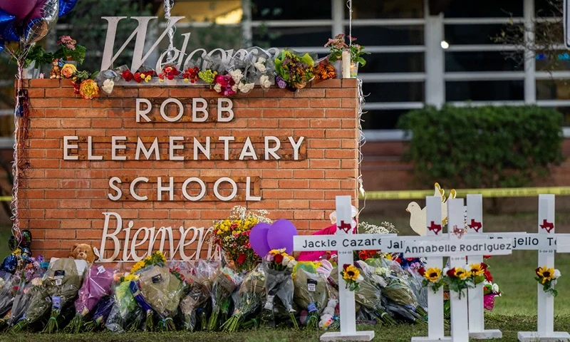 Mass Shooting At Elementary School In Uvalde, Texas Leaves At Least 21 Dead UVALDE, TEXAS - MAY 26: A memorial is seen surrounding the Robb Elementary School sign following the mass shooting at Robb Elementary School on May 26, 2022 in Uvalde, Texas. According to reports, 19 students and 2 adults were killed, with the gunman fatally shot by law enforcement. (Photo by Brandon Bell/Getty Images)