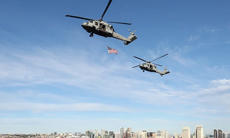 SAN DIEGO, CALIFORNIA - NOVEMBER 11: US Navy helicopters perform a flyover prior to the Armed Forces Classic between the Michigan State Spartans and the Gonzaga Bulldogs aboard the USS Abraham Lincoln aircraft carrier on November 11, 2022 in San Diego, California. (Photo by Sean M. Haffey/Getty Images)