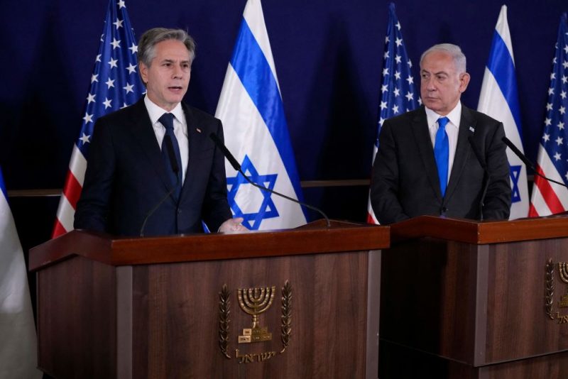 Israeli Prime Minister Benjamin Netanyahu (R) looks on as US Secretary of State Antony Blinken gives statements to the media inside The Kirya, which houses the Israeli Defence Ministry, after their meeting in Tel Aviv on October 12, 2023. Blinken arrived in a show of solidarity after Hamas's surprise weekend onslaught in Israel, an AFP correspondent travelling with him reported. He is expected to visit Israeli Prime Minister Benjamin Netanyahu as Washington closes ranks with its ally that has launched a withering air campaign against Hamas militants in the Gaza Strip. (Photo by Jacquelyn Martin / POOL / AFP) (Photo by JACQUELYN MARTIN/POOL/AFP via Getty Images)