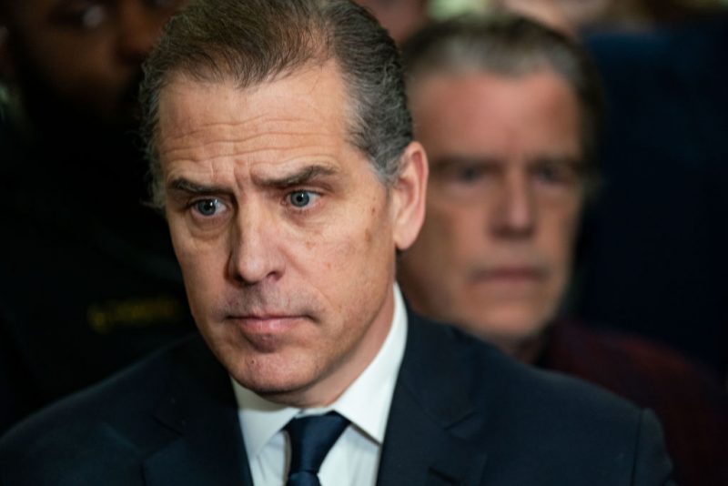 WASHINGTON, DC - JANUARY 10:Hunter Biden, son of U.S. President Joe Biden listens as his lawyer Abbe Lowell speaks to the press outside a House Oversight Committee meeting on January 10, 2024 in Washington, DC. The committee is meeting today as it considers citing him for Contempt of Congress. (Photo by Kent Nishimura/Getty Images)