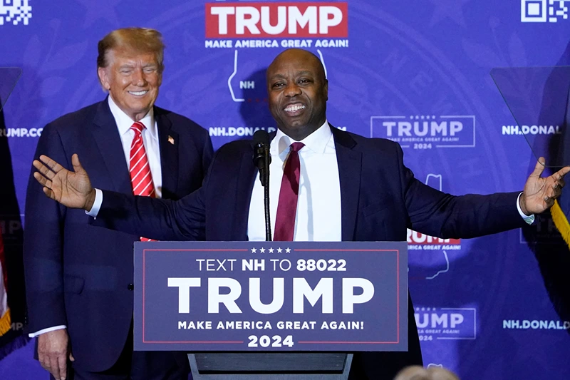 US-POLITICS-VOTE-TRUMP
US Republican Senator from South Carolina Tim Scott speaks as Republican presidential hopeful and former US President Donald Trump listens during a campaign event in Concord, New Hampshire, on January 19, 2024. Senator Tim Scott announces his endorsement of former president Trump to be the Republican presidential candidate in a boost to the former president's bid to secure his party's backing to retake the White House. (Photo by TIMOTHY A. CLARY / AFP) (Photo by TIMOTHY A. CLARY/AFP via Getty Images)