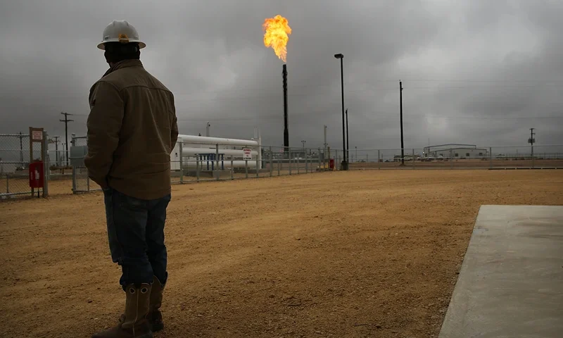 GARDEN CITY, TX - FEBRUARY 05: Flared natural gas is burned off at Apache Corporations operations at the Deadwood natural gas plant in the Permian Basin on February 5, 2015 in Garden City, Texas. Apache sends an estimated 50-52 million cubic feet per day of natural gas to this plant. As crude oil prices have fallen nearly 60 percent globally, many American communities that became dependent on oil revenue are preparing for hard times. Texas, which benefited from hydraulic fracturing and the shale drilling revolution, tripled its production of oil in the last five years. The Texan economy saw hundreds of billions of dollars come into the state before the global plunge in prices. Across the state drilling budgets are being slashed and companies are notifying workers of upcoming layoffs. According to federal labor statistics, around 300,000 people work in the Texas oil and gas industry, 50 percent more than four years ago. (Photo by Spencer Platt/Getty Images)