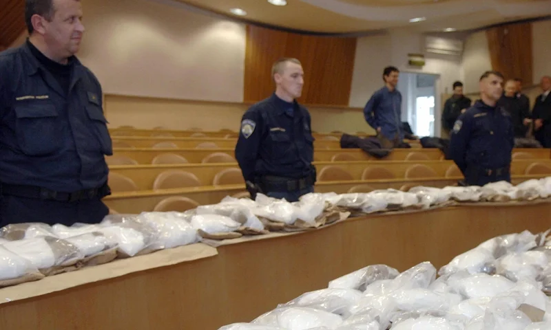 Croatian policemen guard some 160 kilos Croatian policemen guard some 160 kilos of cocaine before showing it at a press conference in Zagreb, 28 November 2007. A south-European network of cocaine smugglers from Ecuador was dismantled and more than 160 kilos of drugs intended for a Bosnian company, were seized by the Croatian and Greek police forces, Croatian police announced 28 November. The drug, whose value was estimated at approximately 11 million euros, was seized in September and October in two intercepted containers of transport one with the Croatian port of Rijeka and the other with the Greek port of Pir?e, close to Athens. AFP PHOTO / Denis Lovrovic (Photo credit should read DENIS LOVROVIC/AFP via Getty Images)